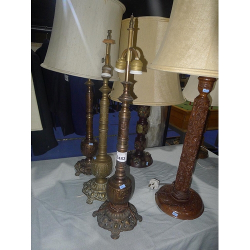 3483 - A set of three 3 ornate oriental brass table lamps with one shade