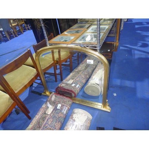 3492 - A gilt framed domed top bevelled overmantle mirror approximately 150cm wide