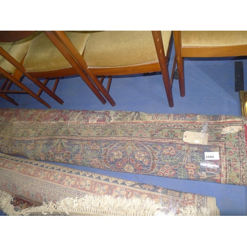 3494 - A multi-coloured floral patterned carpet approximately 380 cm x 300 cm