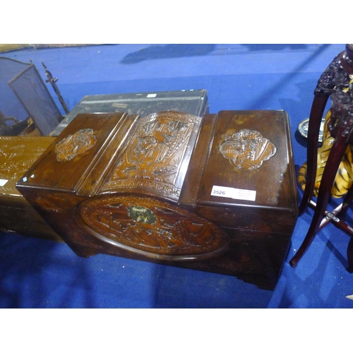 3526 - A heavily carved oriental camphor wood chest with a lift lid, approximately 100 cm wide