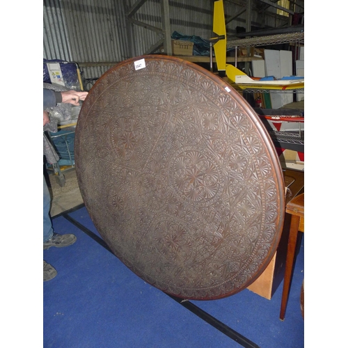 3547 - A heavily carved dark wood circular table top approximately 138 cm diameter (no legs included)