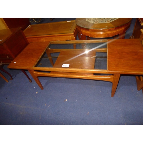 3553 - A vintage G-Plan rectangular topped glass-topped coffee table with shelf under, approximately 136cm ... 