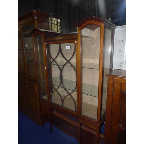 3567 - An Edwardian inlaid mahogany display cabinet with a glass panelled door enclosing shelves, approxima... 