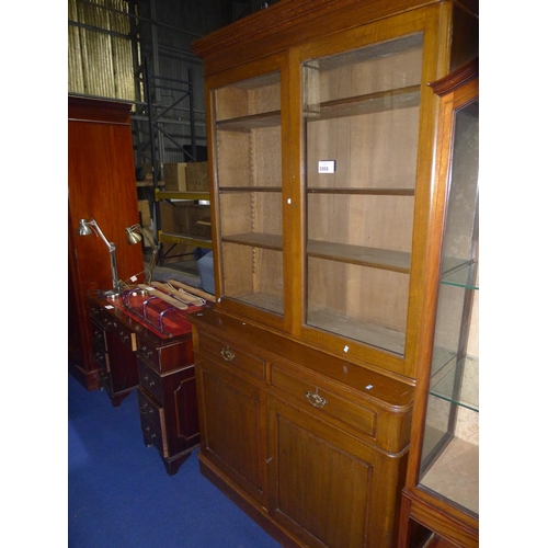 3568 - An Edwardian mahogany bookcase cabinet with 2 glazed doors enclosing shelves, 2 drawers and 2 panel ... 