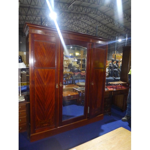 3572 - An Edwardian marquetry inlaid mahogany triple wardrobe with a mirror door and two panelled doors, ap... 