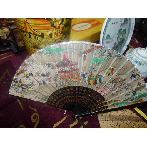 3323 - A decorative Japanese fan and 2 decorative wooden fans