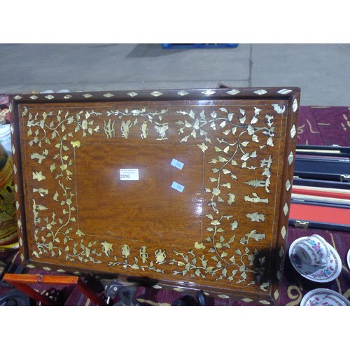 3316 - A large rectangular mother of pearl inlaid wooden tea tray, and oriental decorated wooden vase and a... 