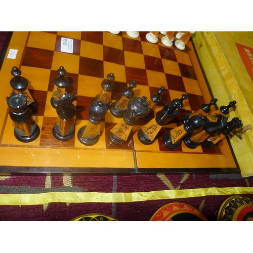 3315 - A carved bamboo Oriental style chess set with chess board