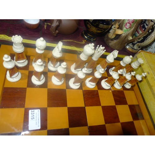 3315 - A carved bamboo Oriental style chess set with chess board