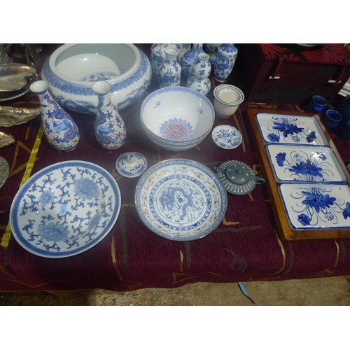 3311 - A large quantity of miscellaneous decorative blue and white oriental patterned chinaware and other b... 