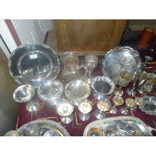 3310 - A large quantity of miscellaneous decorative silver-plated ware, cutlery and other metalware etc