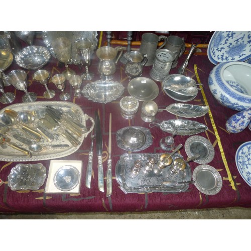 3310 - A large quantity of miscellaneous decorative silver-plated ware, cutlery and other metalware etc