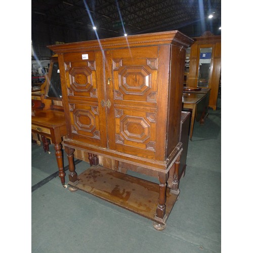 3453 - A 19th Century Oak cabinet on stand with two carved doors and shelf under approx 116cm wide x 153cm ... 