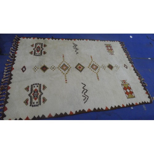 3495 - A brown and white patterned carpet approx 300 cm x 210 cm