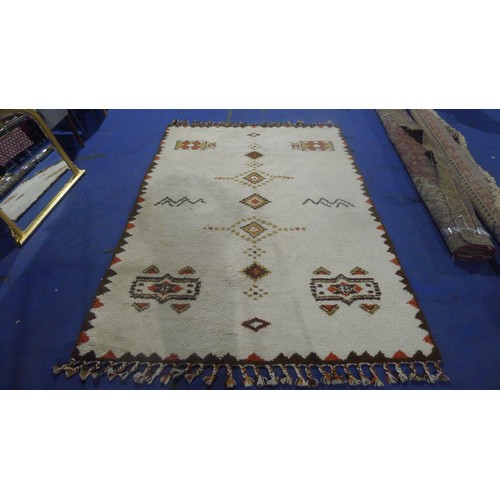 3495 - A brown and white patterned carpet approx 300 cm x 210 cm