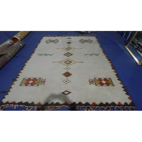 3495 - A brown and white patterned carpet approx 300 cm x 210 cm