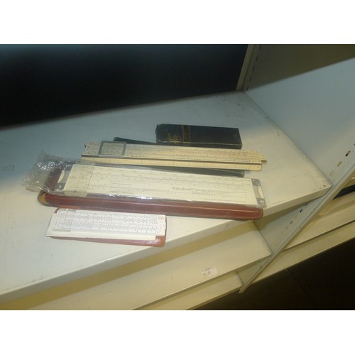 3155 - A quantity of miscellaneous vintage slide rules and other precision measuring instruments one shelf