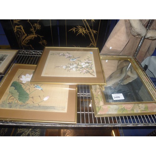 3490 - A rectangular wall mirror in a gilt decorated frame and several small framed oriental silk pictures ... 