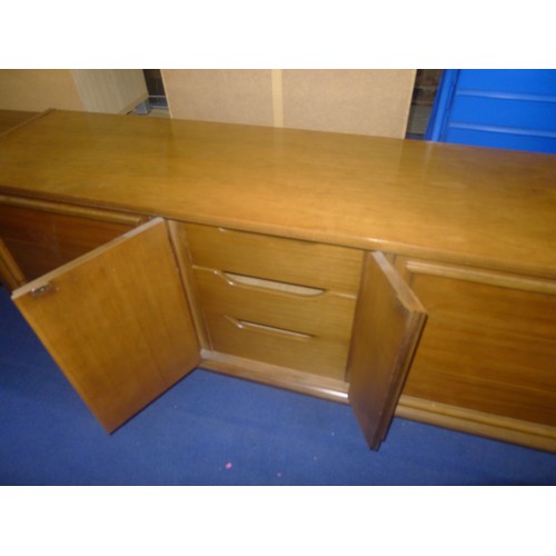 3564 - A 1980s vintage medium wood sideboard with drawers and cupboards, approximately 188cm wide