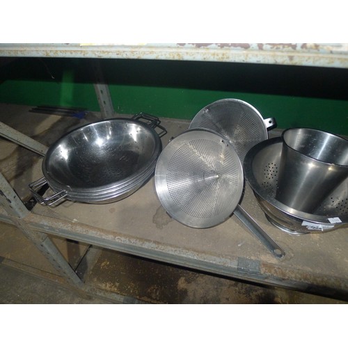 1046 - A quantity of various catering related stainless steel items including colanders, sieves, graters et... 