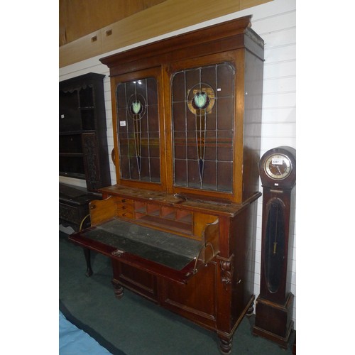 3358 - A Victorian stained secretaire bookcase with two leaded glazed doors above enclosing adjustable shel... 