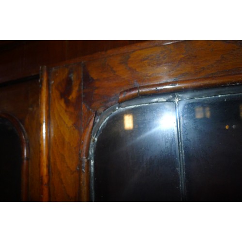 3358 - A Victorian stained secretaire bookcase with two leaded glazed doors above enclosing adjustable shel... 