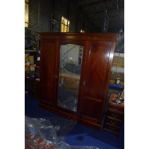 3572 - An Edwardian marquetry inlaid mahogany triple wardrobe with a mirror door and two panelled doors, ap... 