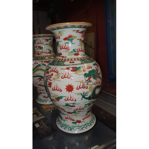 3178 - A pair of multi-coloured Chinese bird and floral decorated bulbous vases, good condition.