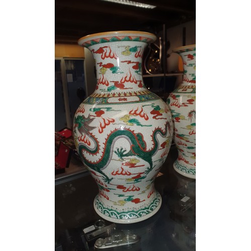 3178 - A pair of multi-coloured Chinese bird and floral decorated bulbous vases, good condition.