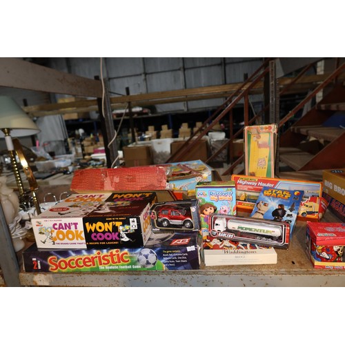 2108 - A quantity of various items including games, toys, CDs, novelty items etc. Contents of 1 bay / 3 she... 