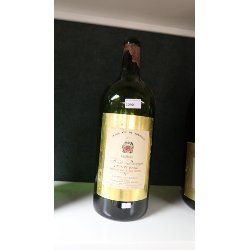 A large jeroboam size Chateau Haut Duverger wine bottle. Empty