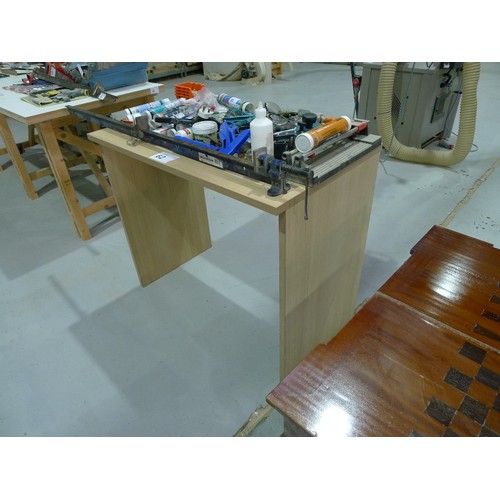 62 - 1 wood effect table approx 110 x 60cm and a quantity of various tools including a tile cutter and a ... 