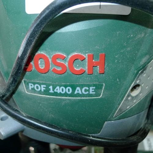 78 - A Bosch router type POF 1400 ACE, 240v, supplied with a fence and a plastic carry case