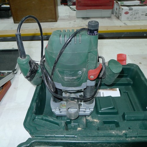 78 - A Bosch router type POF 1400 ACE, 240v, supplied with a fence and a plastic carry case