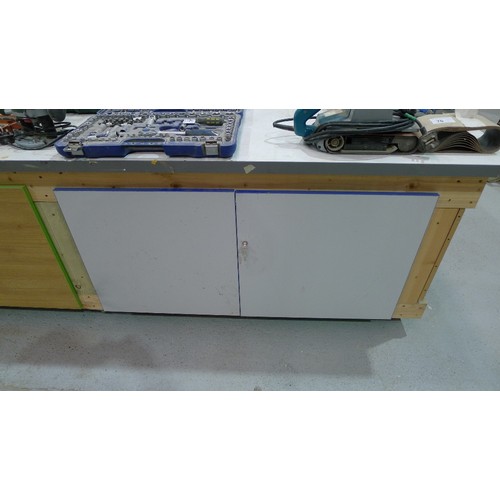 83 - 1 wooden work bench on wheels with two cupboards below approx 305 x 122cm