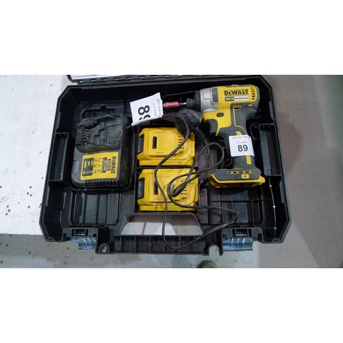 89 - A Dewalt cordless 18v XR Brushless impact driver type DCF787 supplied with 2 batteries, 1 charger an... 