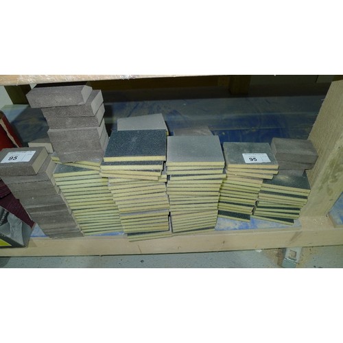 95 - A quantity of various abrasives including sheets, a part roll of Mirka P180, pads and blocks