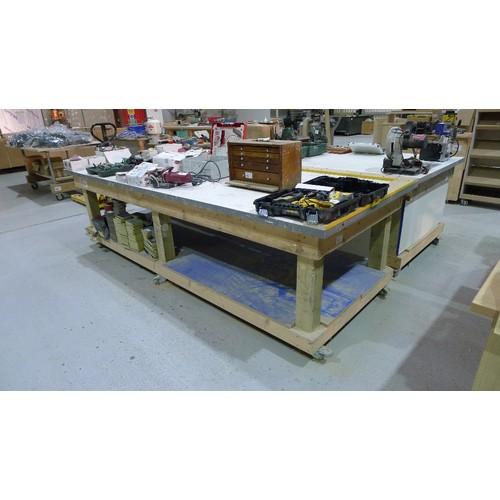 96 - 1 wooden work bench on wheels with shelf below approx 305 x 122cm