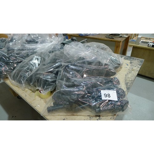 98 - A quantity of various items including black plastic kitchen cabinet legs, hinges, cam inserts etc