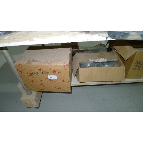 98 - A quantity of various items including black plastic kitchen cabinet legs, hinges, cam inserts etc