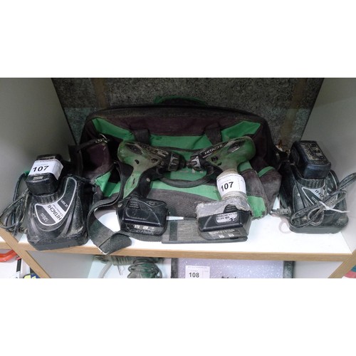 107 - 2 Hitachi cordless compact drill drivers type DB10DL with 4 batteries, 2 chargers and a Hitachi bag