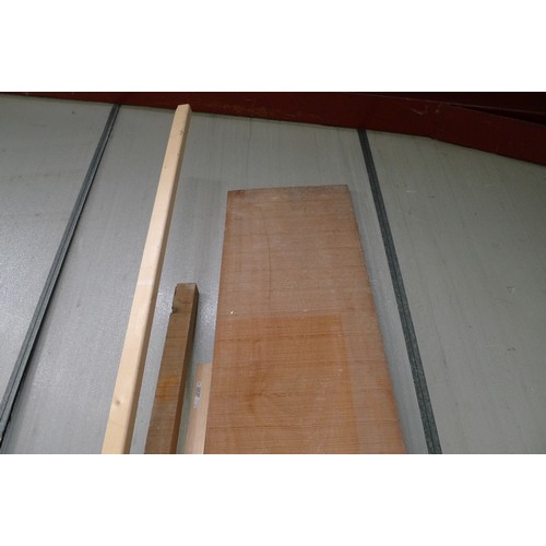 123 - A quantity of various lengths of wood including a sawn board at approx 305cm long x 48cm wide x 3cm ... 