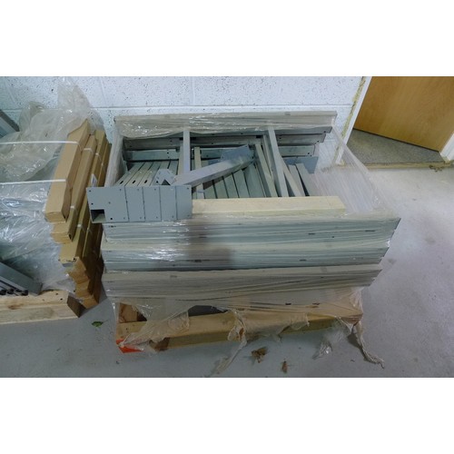 140 - 5 pallets containing a quantity of various grey metal table frame parts