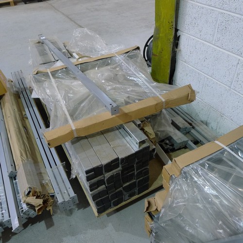 140 - 5 pallets containing a quantity of various grey metal table frame parts