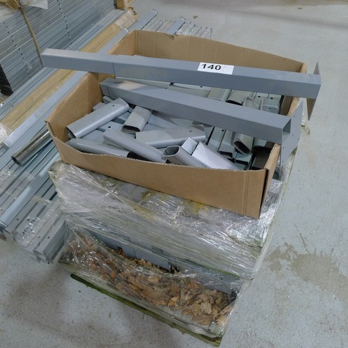 140 - 5 pallets containing a quantity of various grey metal table frame parts