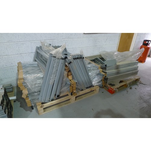 140 - 5 pallets containing a quantity of various grey metal table frame parts