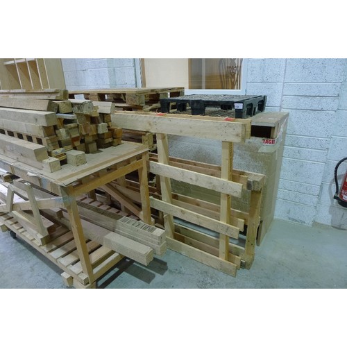 148 - A set of pallet trucks by Barlow (arms are splayed and require attention), a wooden bench on wheels ... 