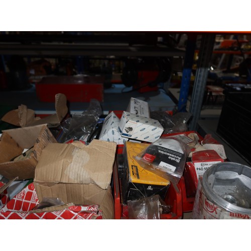 1212 - A quantity of plastic Lin type storage bins containing various auto related items including brake pa... 