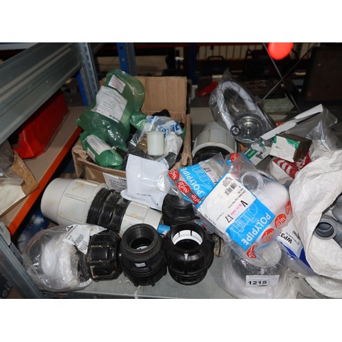 1215 - A quantity of various plumbing related items including wastes, bowl plumbing kits, bottle traps, pla... 