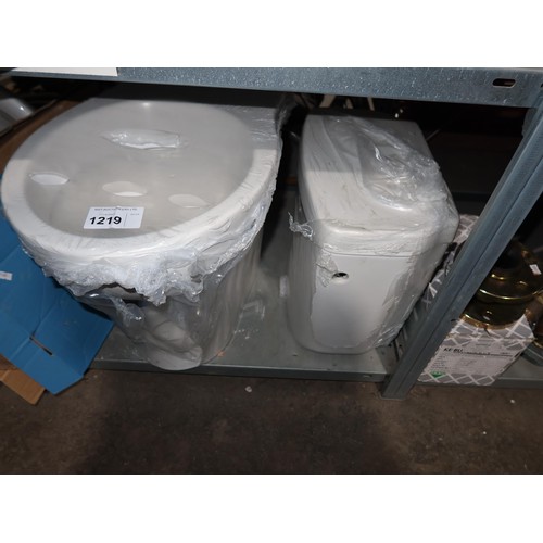 1219 - A white ceramic toilet pan, a cistern with lid, a toilet seat, a large hand basin and a small hand b... 